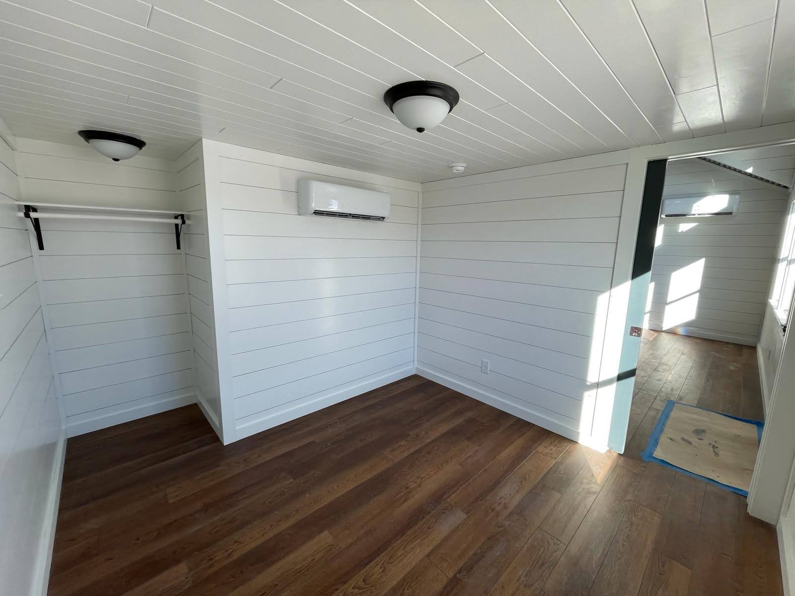 Wolf Valley interior showing white wall and ceiling finishes with wood-look flooring